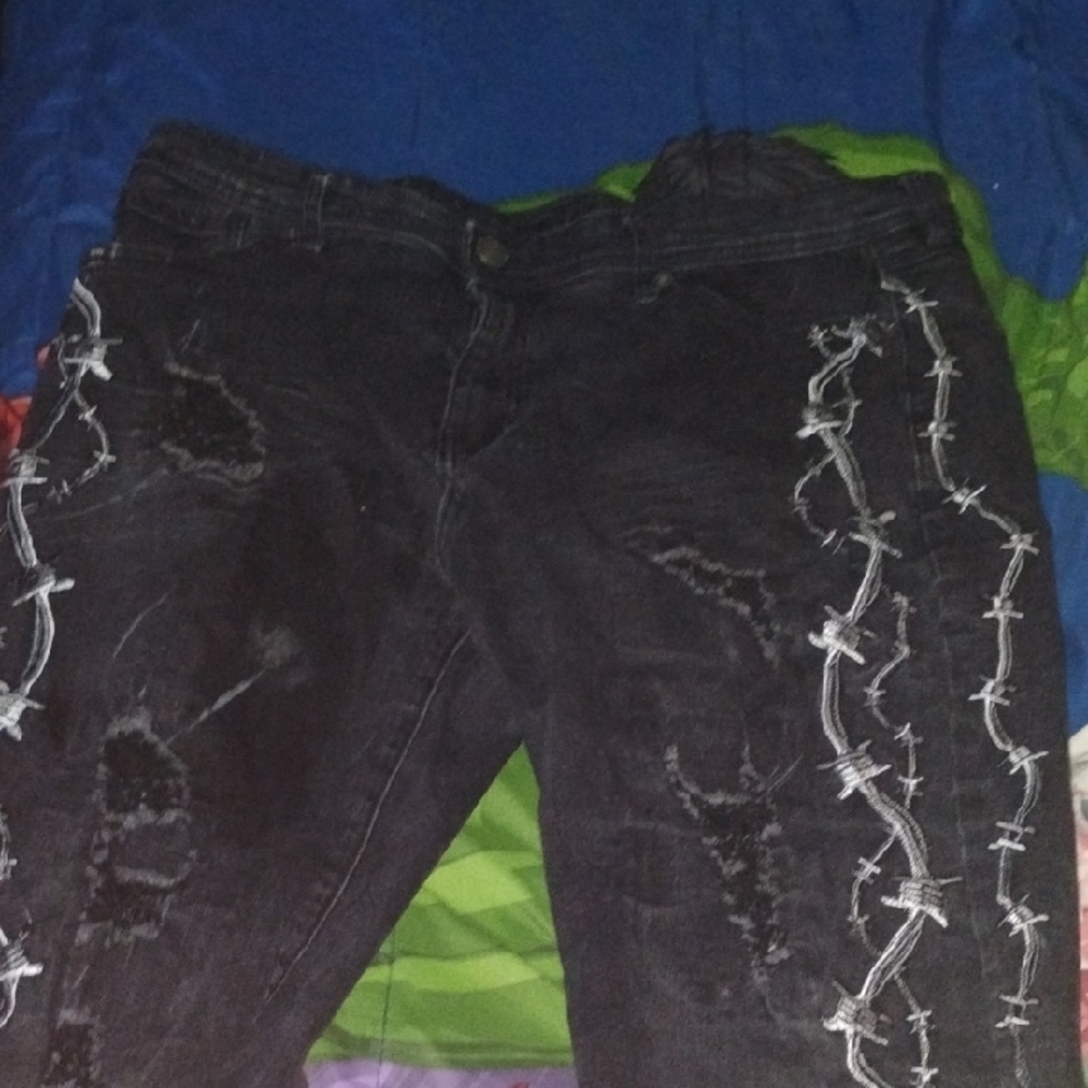 Stylish Black Distressed Jeans with White Stitching